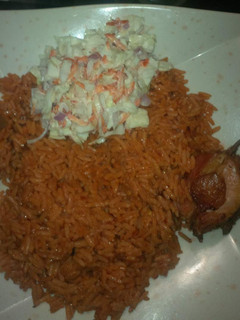 A picture of Jollof rice and chicken.