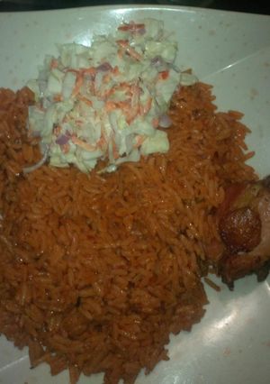 A picture of Jollof rice and chicken.