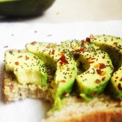 A picture of Avocado toast with poppy seeds.