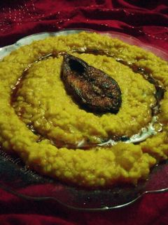 A picture of Bengali iLish khichri/ Hilsha Fish Fry with Liquid khichri.