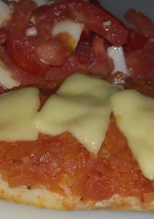 Una foto de Filete de merluza a la pizza