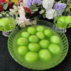 A picture of Aam panna flavour rasgulla.