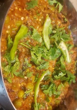 A picture of Cooked Eggplant bharta with peas.