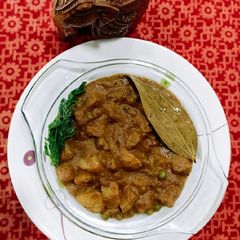 Aloo Matar In Thick Brown Gravy A picture of Aloo Matar In Thick Brown Gravy.