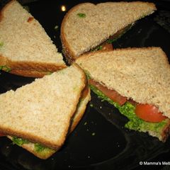 A picture of Cucumber and Tomato Sandwiches with Mint-Coriander Chutney.