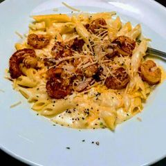A picture of Cajun Shrimp Penne Pasta with Parmesan Cream Sauce.