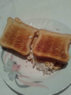 A picture of Fried white of eggs toast sandwich with white cheese 🥪.