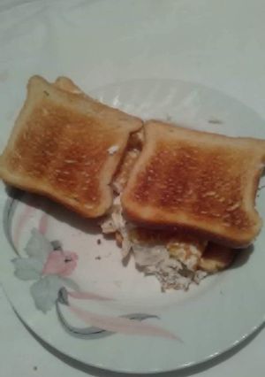 A picture of Fried white of eggs toast sandwich with white cheese 🥪.