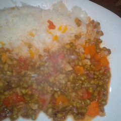 A picture of Green grams served with rice.