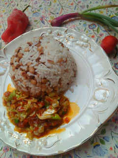 A picture of Rice and beans with sauce.