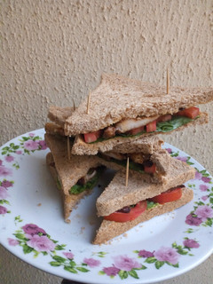 A picture of Grilled chicken sandwich with wheat bread.