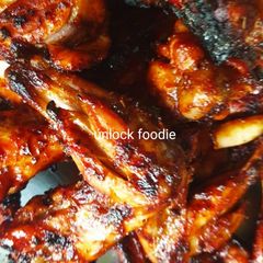 A picture of Tandoori chicken leg piece.