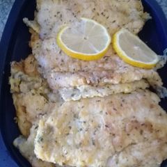 A picture of Hake fish with parsley.
