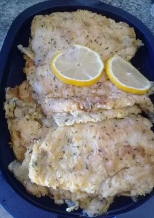A picture of Hake fish with parsley.