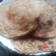 A picture of Paneer stuffed lachha paratha.