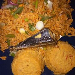 A picture of Jollof rice and moimoi.
