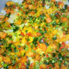 A picture of Rice with vegetable sauce.
