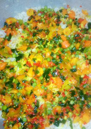 A picture of Rice with vegetable sauce.