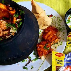 Matka Biryani With Grilled Paneer Tikka A picture of Matka Biryani With Grilled Paneer Tikka.