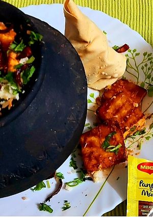 A picture of Matka Biryani With Grilled Paneer Tikka.