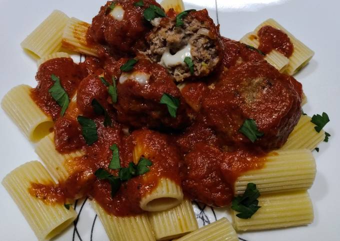 Simple Way to Make Homemade Mozzarella stuffed meatballs in tomato sauce