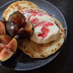 A picture of Mini Greek pancakes with figs and Greek yogurt with honey.