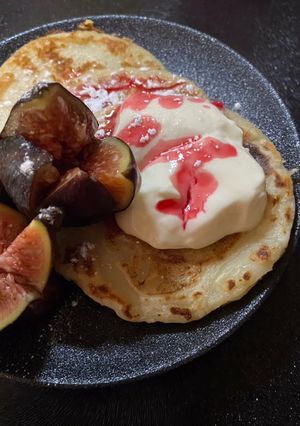 A picture of Mini Greek pancakes with figs and Greek yogurt with honey.