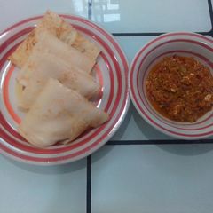 A picture of Crepes with egg and pepper sauce.