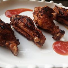 A picture of 3 spice fried chicken wings.