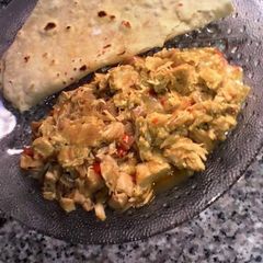 A picture of Chapati and chicken sauce.