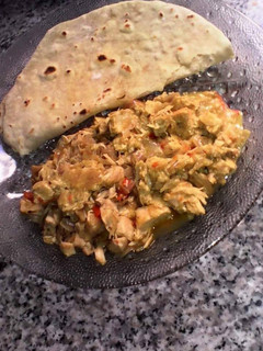 A picture of Chapati and chicken sauce.
