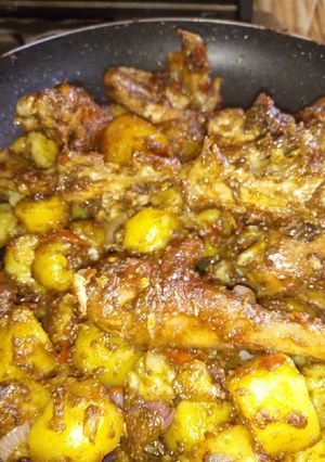 A picture of Chicken and potatoes mixed.
