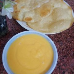 A picture of Aam ka Ras/ Amrus with poriyan.