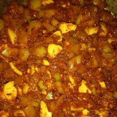 A picture of Boiled eggs in hungarian paprikash sauce.