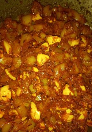 A picture of Boiled eggs in hungarian paprikash sauce.