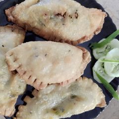 A picture of D shape samosa.