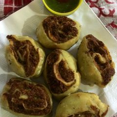 A picture of Bhakarwadi stuffed with peas.