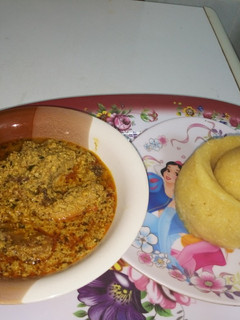 A picture of Turkey Meat Egusi Soup with Eba.