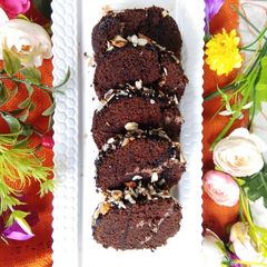 Chocolate Swiss roll on pan A picture of Chocolate Swiss roll on pan.