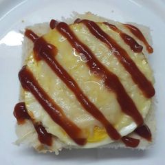 A picture of Cheese sandwich with omelette.