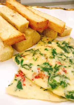 A picture of Vegetable omelette and fried yam.