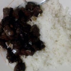 A picture of White rice with fried liver.