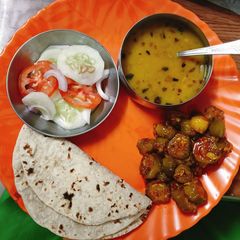 A picture of Kundru Peanut masala with Chapati Daal and salad.