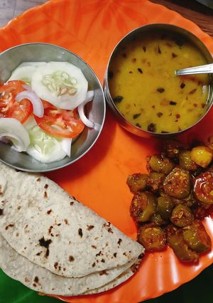 A picture of Kundru Peanut masala with Chapati Daal and salad.