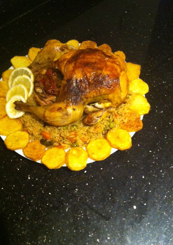 A picture of Roasted chicken with rice and veg.