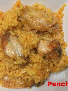 Una foto de Arroz de calasparra con alitas adobadas