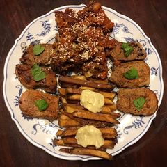 A picture of California Farm Glazed Cauliflower Rosettes with Pork Tenderloin Medallions.