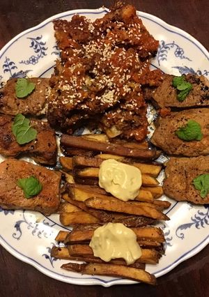 A picture of California Farm Glazed Cauliflower Rosettes with Pork Tenderloin Medallions.