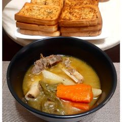 A picture of Mutton Stew with Veggies.
