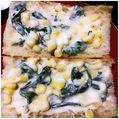 A picture of Spinach and Corn open faced sandwich.